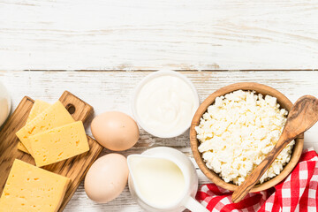 Dairy product at white wooden table.