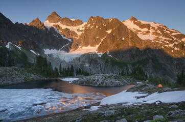 USA, Washington State. Mount Shuksan seen from partially frozen Lake Ann, Mount Baker Wilderness, North Cascades.