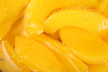 Fototapeta na wymiar Canned yellow peach background