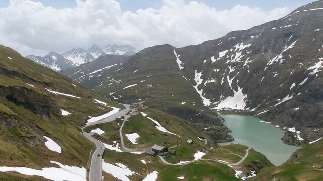 Mountain road and lake in Austrian Apls. Grossglockner.