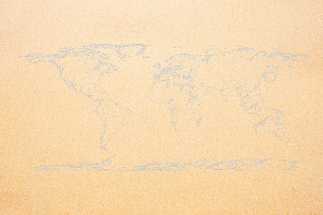 World map on sand texture surface use for background.
(Outline elements of world map image from NASA public domain)
