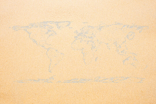 World Map On Sand Texture Surface Use For Background.
(Outline Elements Of World Map Image From NASA Public Domain)
