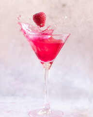 Pink Cocktail drink with a Raspberry