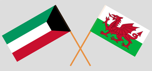 Crossed flags of Kuwait and Wales. Official colors. Correct proportion