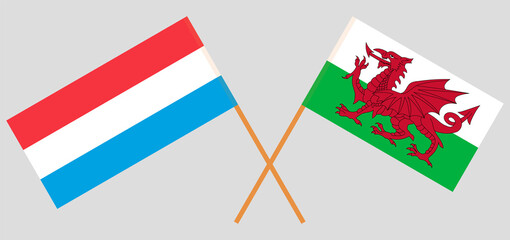 Crossed flags of Luxembourg and Wales. Official colors. Correct proportion