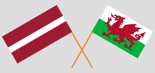 Crossed flags of Latvia and Wales. Official colors. Correct proportion