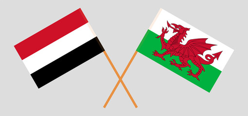 Crossed flags of Yemen and Wales. Official colors. Correct proportion