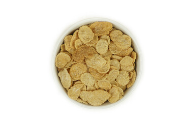 A cup of cornflakes, top view.. Isolated