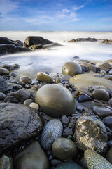 USA, Washington State, Olympic National Park. Sunrise on coast beach and rocks.
