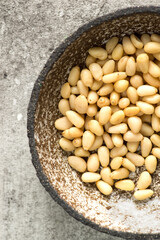pine nuts in a gray bowl