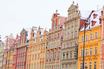 Fototapeta premium winter daytime snowy old buildings of wroclaw city in poland