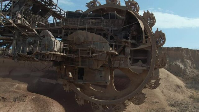A large bucket-wheel rotary excavator closeup. 