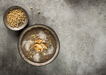 cream soup of champignons on a gray background