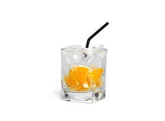 Orange lemonade with ice in a clear glass isolated on a white background.