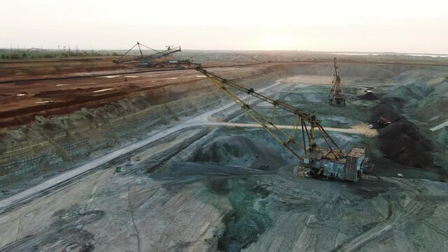 Excavator in a quarry. Manganese ore mining. 