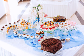 Candy, chocolate bar. Delicious sweet buffet with muffins. Sweet festive buffet with other desserts.