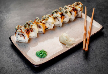 Japanese sushi rolls on a stone background	