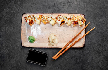 Japanese sushi rolls on a stone background	
