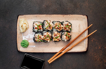 Japanese sushi rolls on a stone background