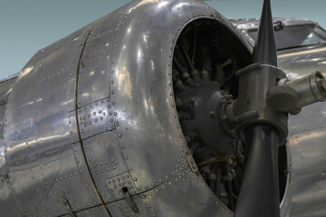 Exterior view of early airliner radial engine, propeller, cowling, and cockpit , nobody