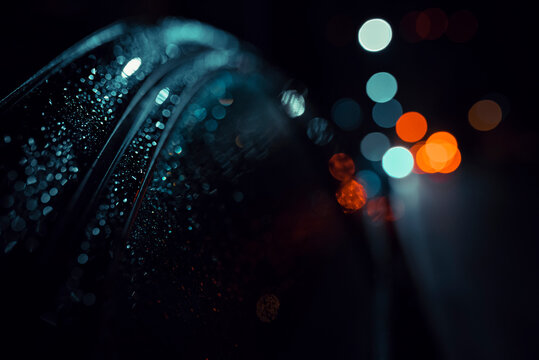 Defocused Image Of Wet Car And Lights