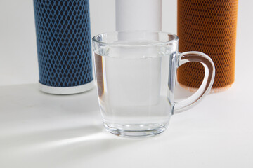Replaceable filters for cleaning tap water. Three-stage water treatment system.