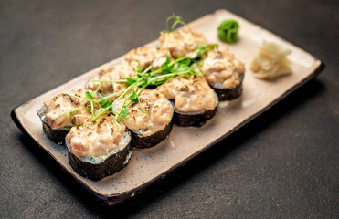 Japanese sushi rolls on a stone background