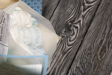 Zephyr bouquet in wrapping paper. Tulips and roses from zephyr. Close-up shot.