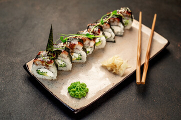  Japanese sushi rolls on a stone background