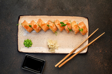  Japanese sushi rolls on a stone background