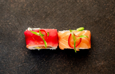 one sushi roll on a stone background
