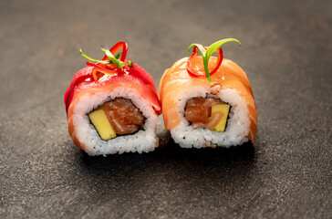 one sushi roll on a stone background