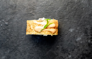 one sushi roll on a stone background	