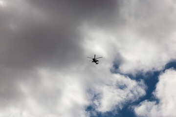 Fototapeta na wymiar a helicopter flying in sky
