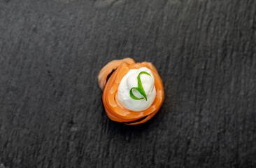 one sushi roll on a stone background