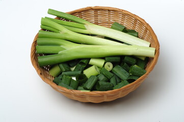 green onions (sometimes called shallots or scallions), isolated on white.