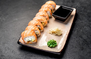 Japanese sushi rolls on a stone background