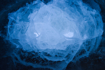 Blue cracked surface of the ice, background, texture