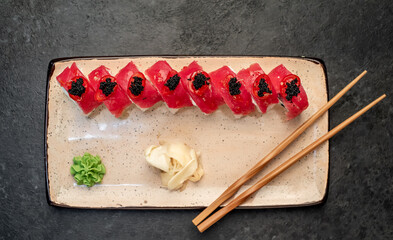 Japanese sushi rolls on a stone background