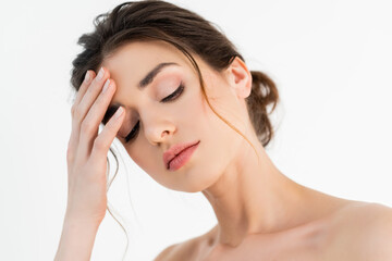 Obraz premium pretty woman with natural makeup holding hand near face isolated on white