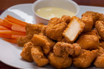 Nugget dish with carrots and sauce