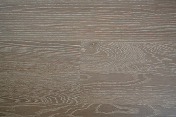 The flooring is made of natural oak with a gray tint and a white patina. Wooden parquet. Creative...