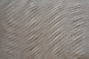 The texture of the upholstery fabric is gray-blue. Corduroy texture. Velvet.