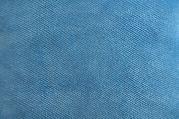 The texture of the upholstery fabric is gray-blue. Corduroy texture. Velvet.