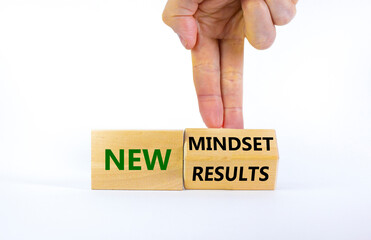 New mindset and results symbol. Businessman turns the wooden block and changes words 'new mindset' to 'new results'. Beautiful white background. Business, new mindset and results concept. Copy space.