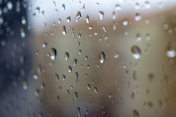 A close-up of raindrops in a window during Winter