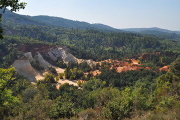 Fototapeta na wymiar Red and white rocks in the south of France at the site of a former quarry - Colorado de Rustrel, France