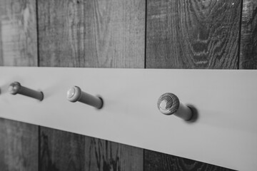 Wooden peg hooks hanging on a wall