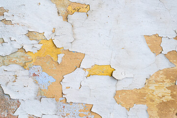 Layers of peeling paint on old wall