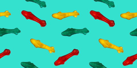 Seamless repeating pattern of marmalade eating sharks. Banner or wallpaper of edible sea fish on a green sea background. 